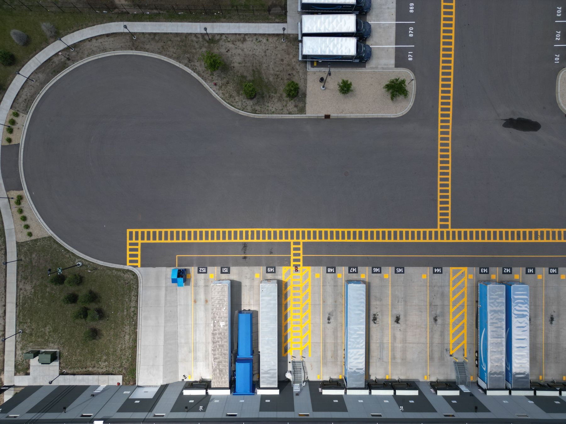 Aerial view of an industrial warehouse loading area